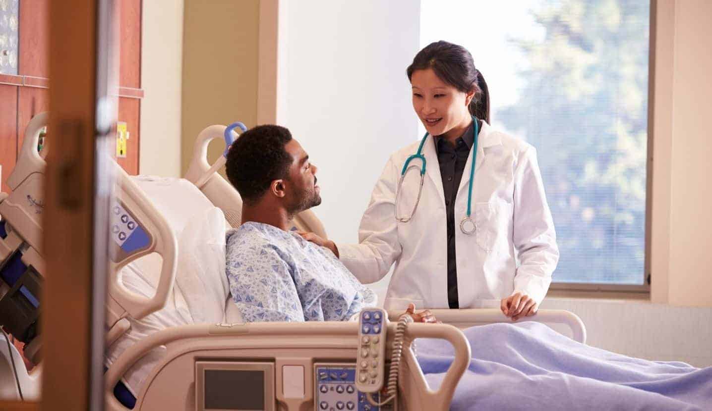 Doctor visits a patient at a hospital.