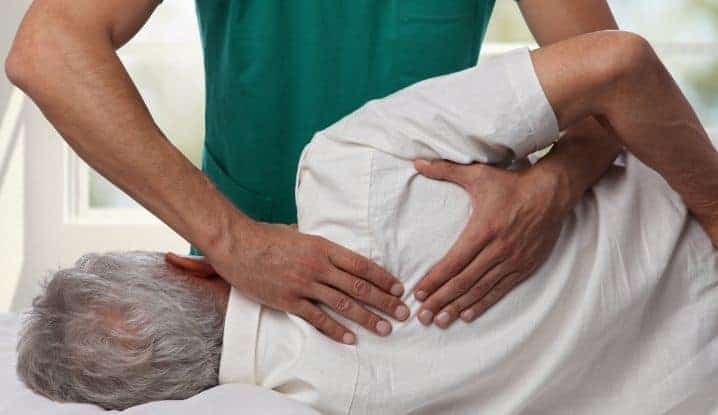 Person getting an adjustment from a chiropractor.